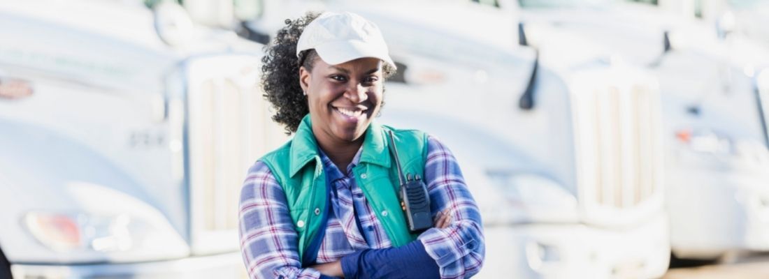 Driver scorecards Female truck driver smiling
