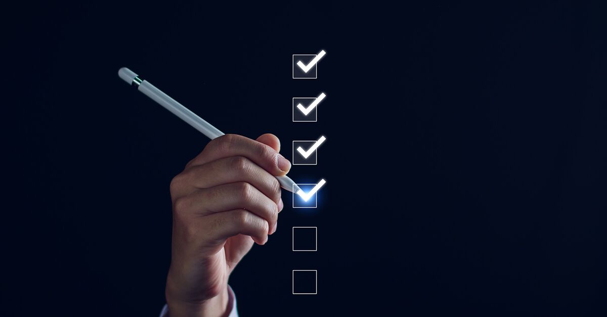 Preventing Human Error_ Essential Tools and Strategies for the Modern Workplace Concept shot of a human hand completing a digital checklist.